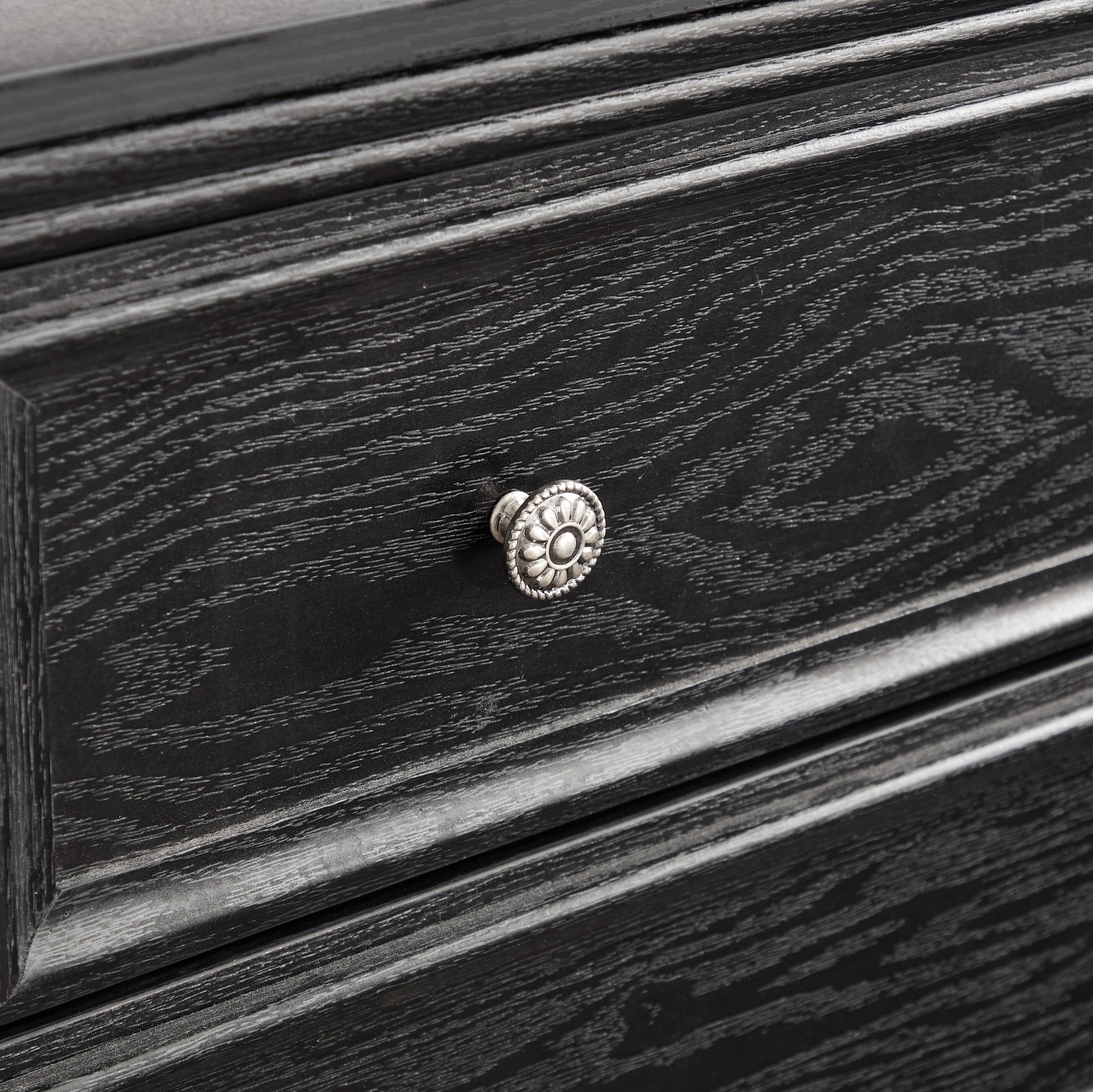 Modern 5-drawer black dresser with textured wood grain and silver rosette knobs on Tampa Home & Garden Store