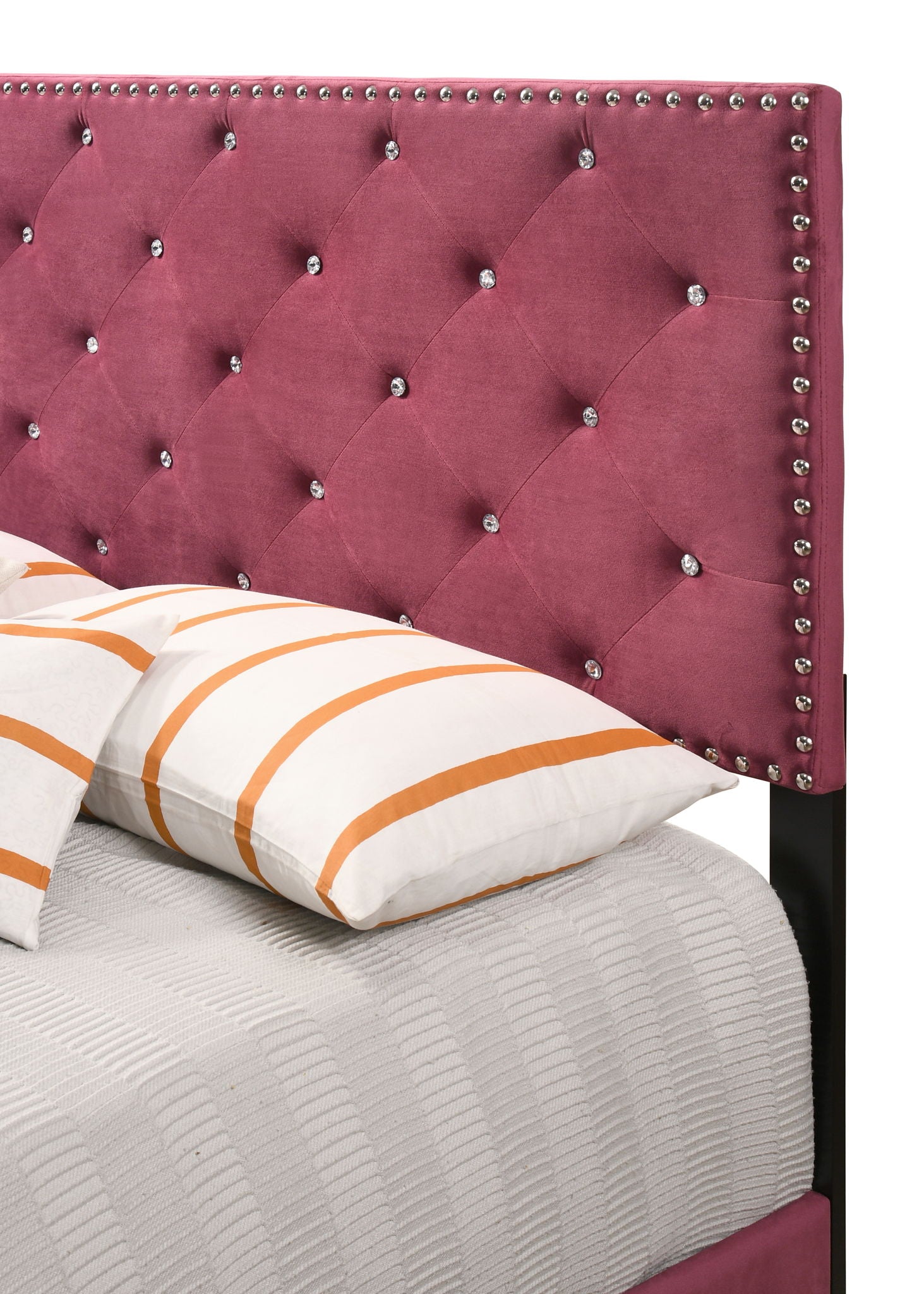 Luxurious upholstered bed with magenta velvet headboard and diamond tufting on Tampa Home & Garden Store