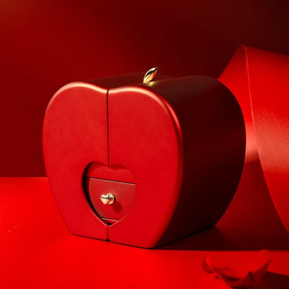 Red apple-shaped jewelry box with heart-shaped inner drawer and gold stem accent on top on Tampa Home & Garden Store