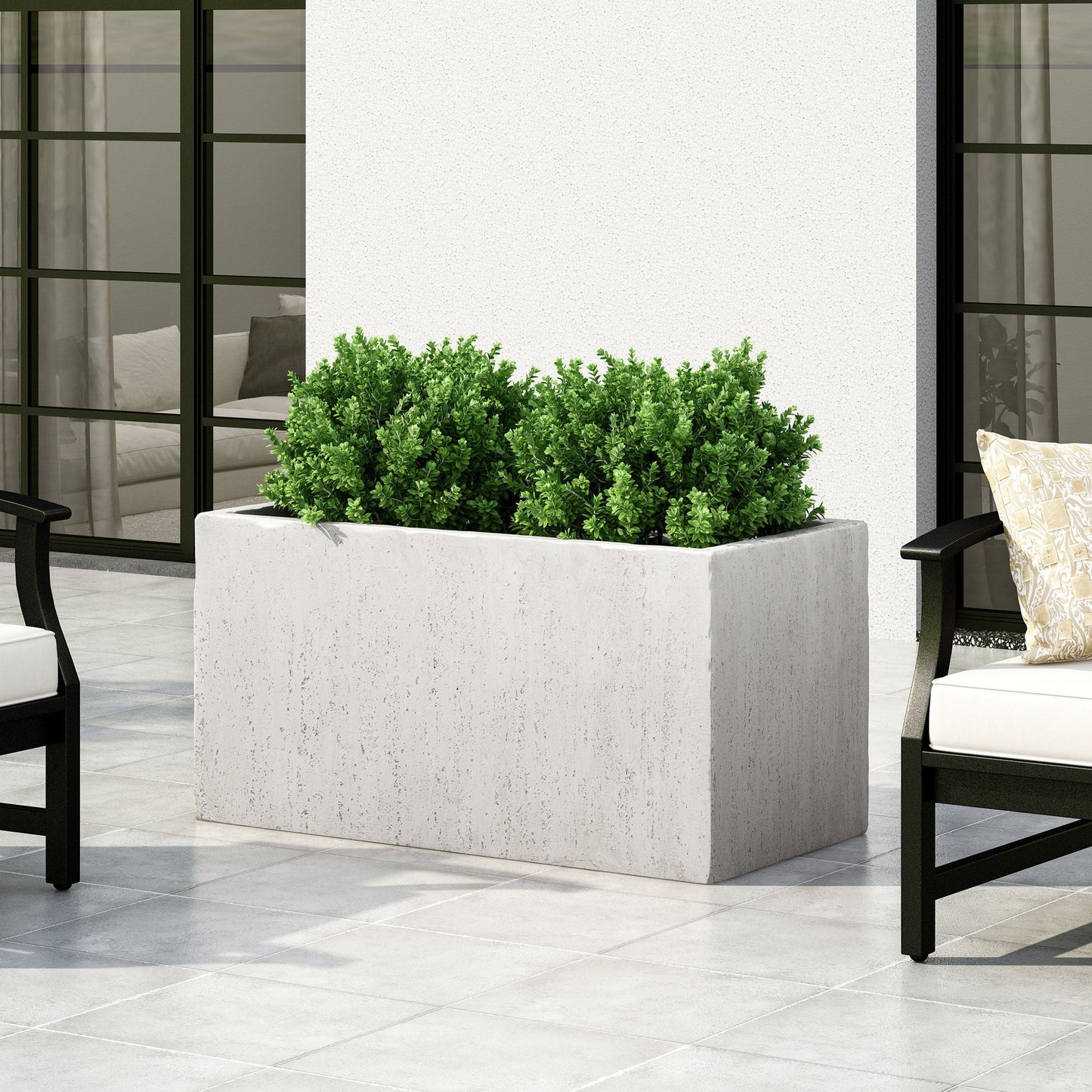 Modern outdoor planter in rectangular concrete with lush green shrub on a patio on Tampa Home & Garden Store