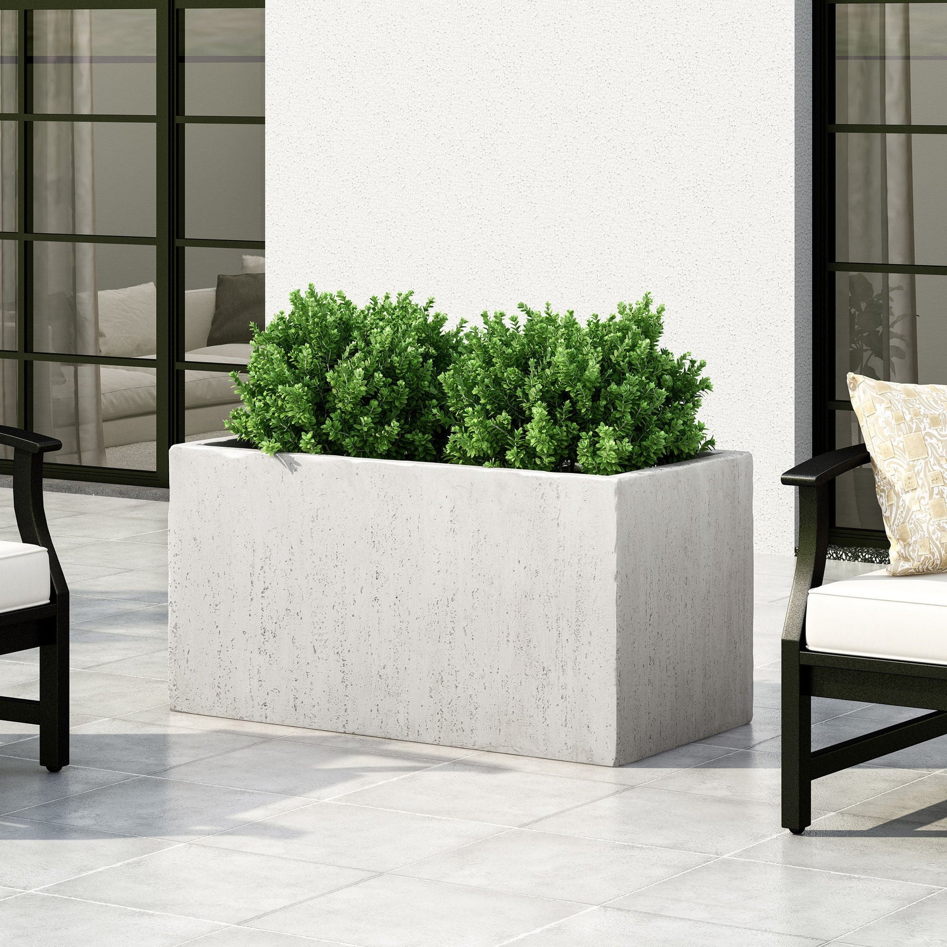 Modern outdoor planter in rectangular concrete with lush green shrub on a patio on Tampa Home & Garden Store