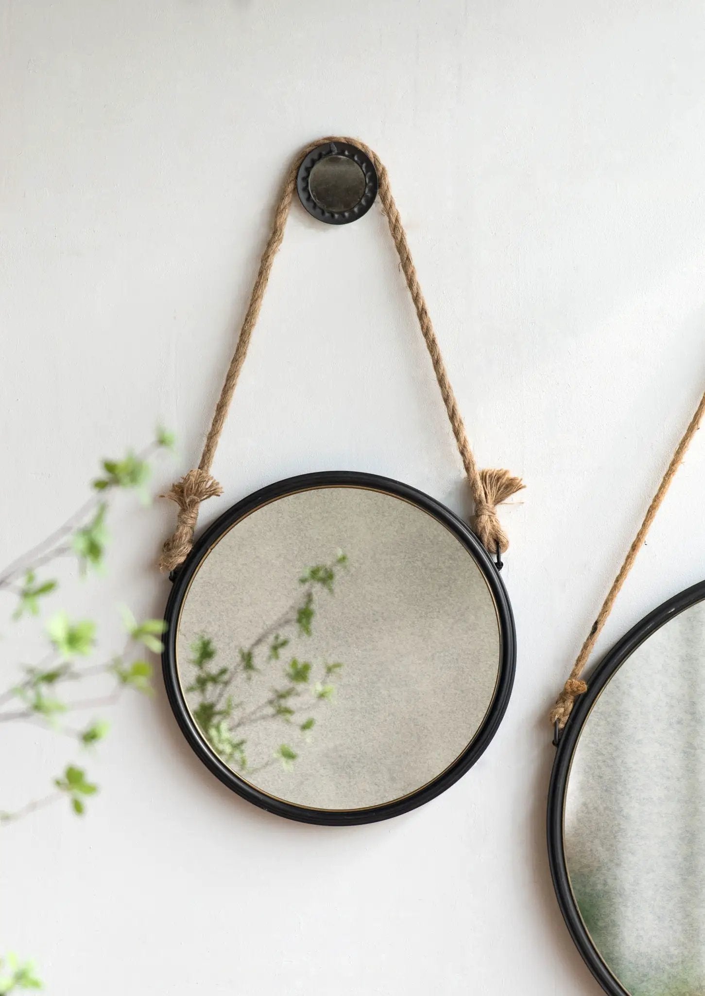 Handsome Cleveland round wall mirror with rope strap and black metal frame for wall decor on Tampa Home & Garden Store