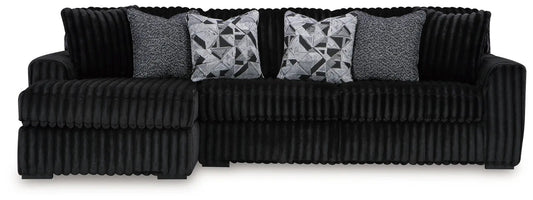 Midnight-Madness Sectional stationary in black ribbed fabric with gray patterned pillows on Tampa Home & Garden Store