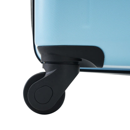Luggage wheel close-up on blue ABS spinner suitcase with textured surface by HouseOfZazla on Tampa Home & Garden Store