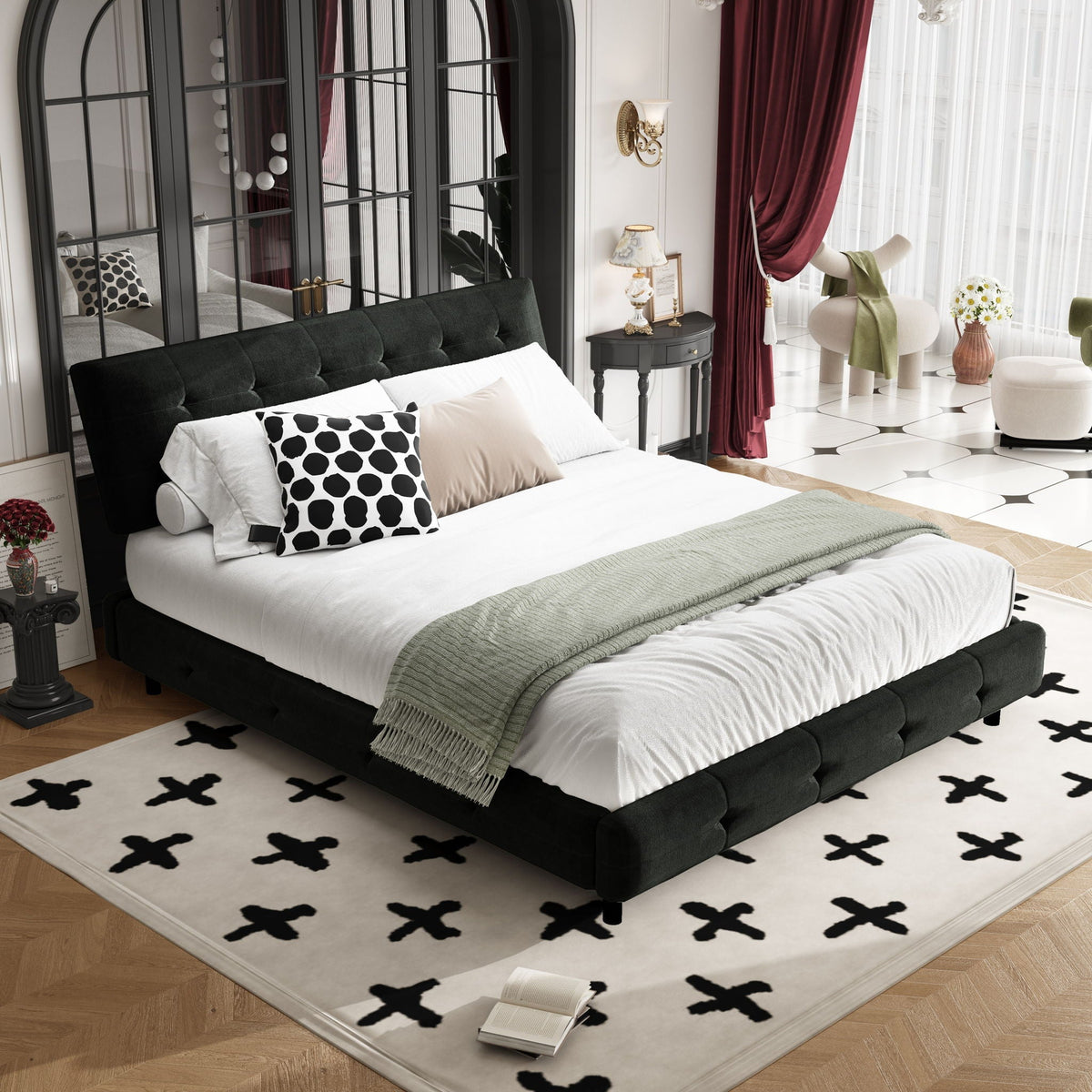 Tufted upholstered bed with black headboard and bedding, accented by black polka-dot pillows on Tampa Home & Garden Store