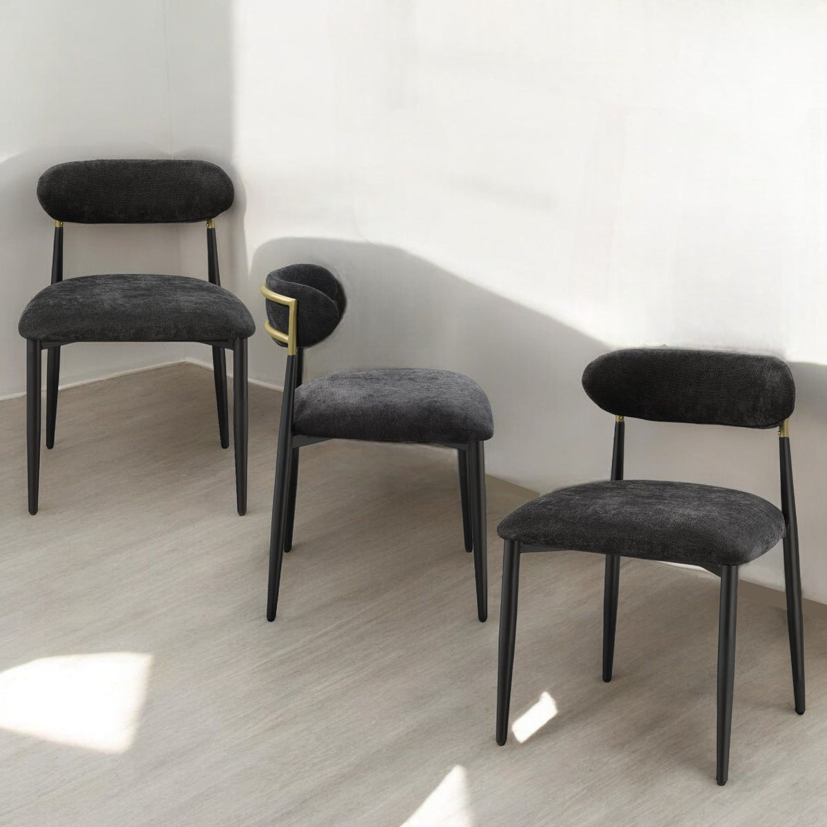 Side chair set with metal frames and padded armrests in black upholstery on Tampa Home & Garden Store