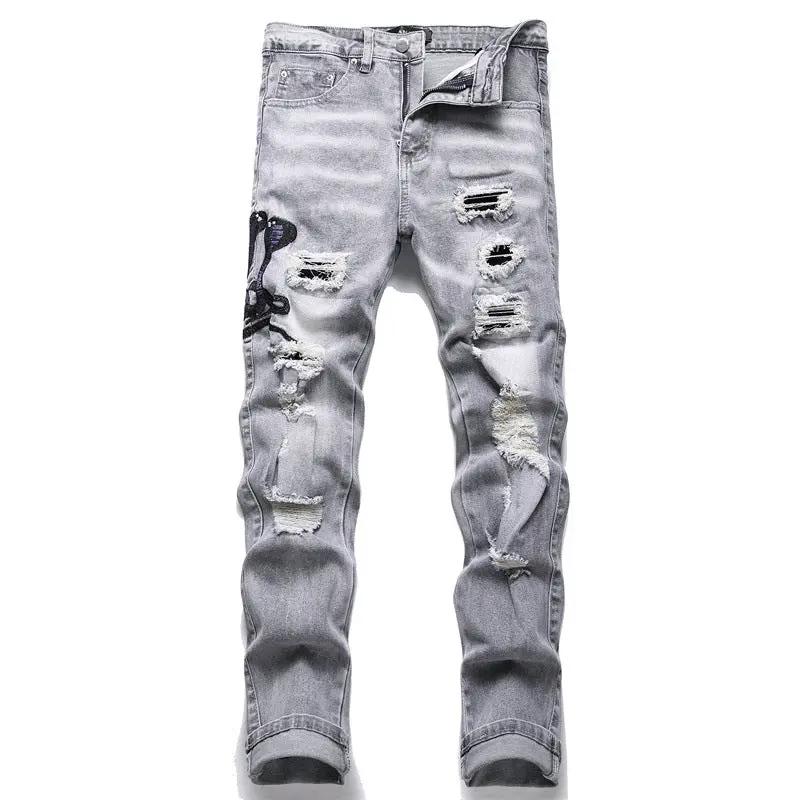 Men's gray distressed jeans with ripped patches and cobra embroidery on left leg, stretch denim on Tampa Home & Garden Store