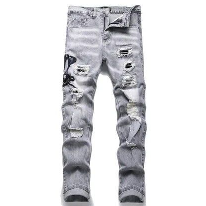 Men's gray distressed jeans with ripped patches and cobra embroidery on left leg, stretch denim on Tampa Home & Garden Store