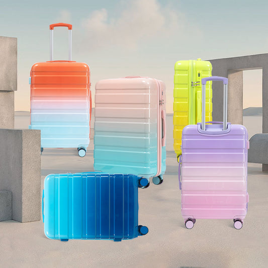 3-Piece gradient spinner luggage set by HouseOfZazla with pastel color blocks and smooth wheels on Tampa Home & Garden Store