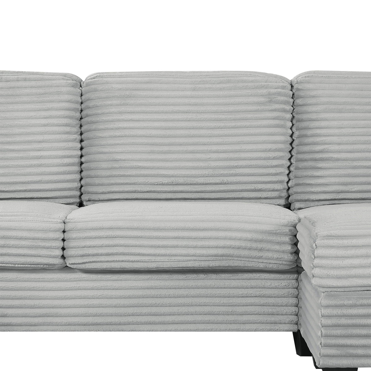 Upholstered sectional sofa cushions in light gray ribbed fabric with horizontal tufting on Tampa Home & Garden Store