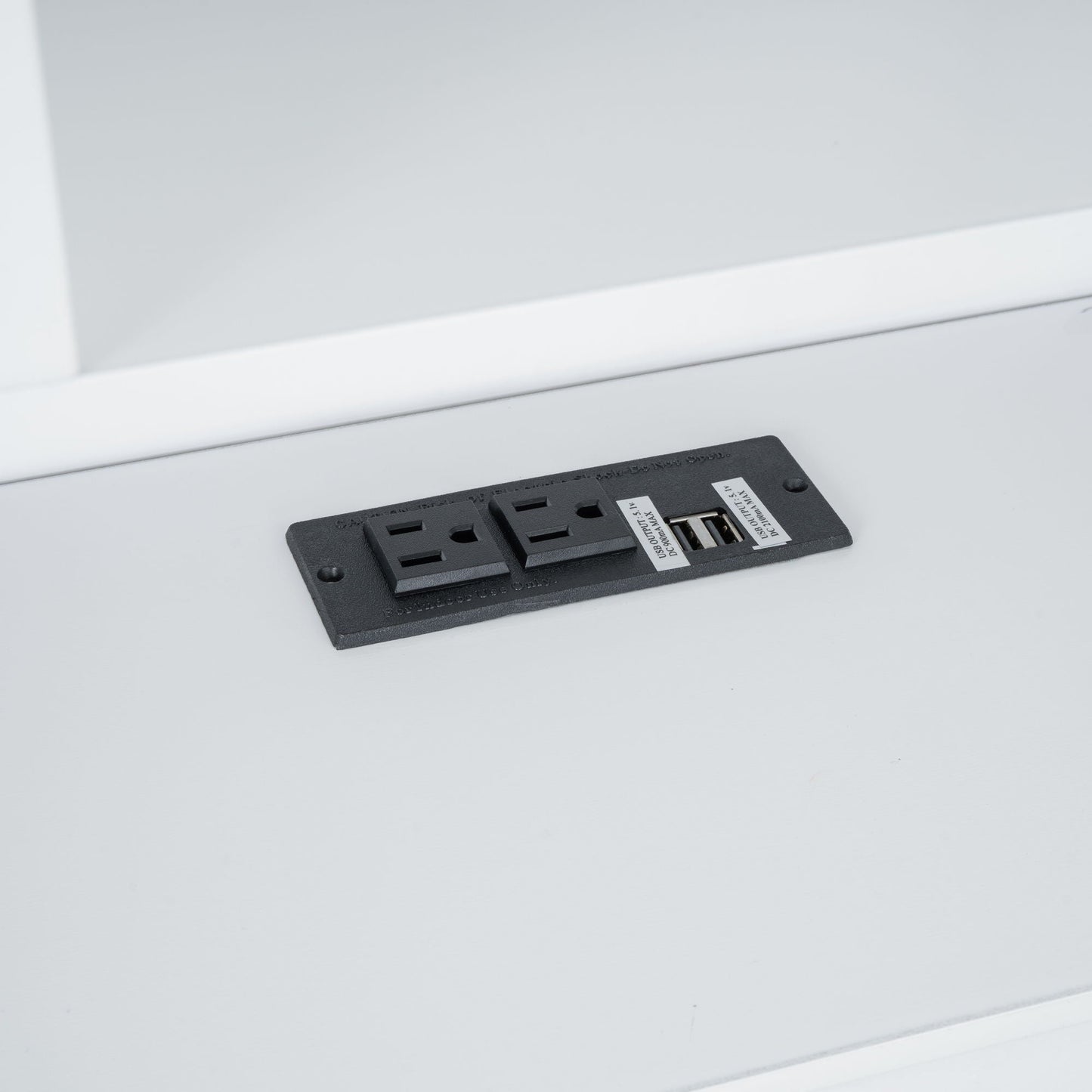 Black platform bed storage panel with USB ports and drawer slots on Tampa Home & Garden Store