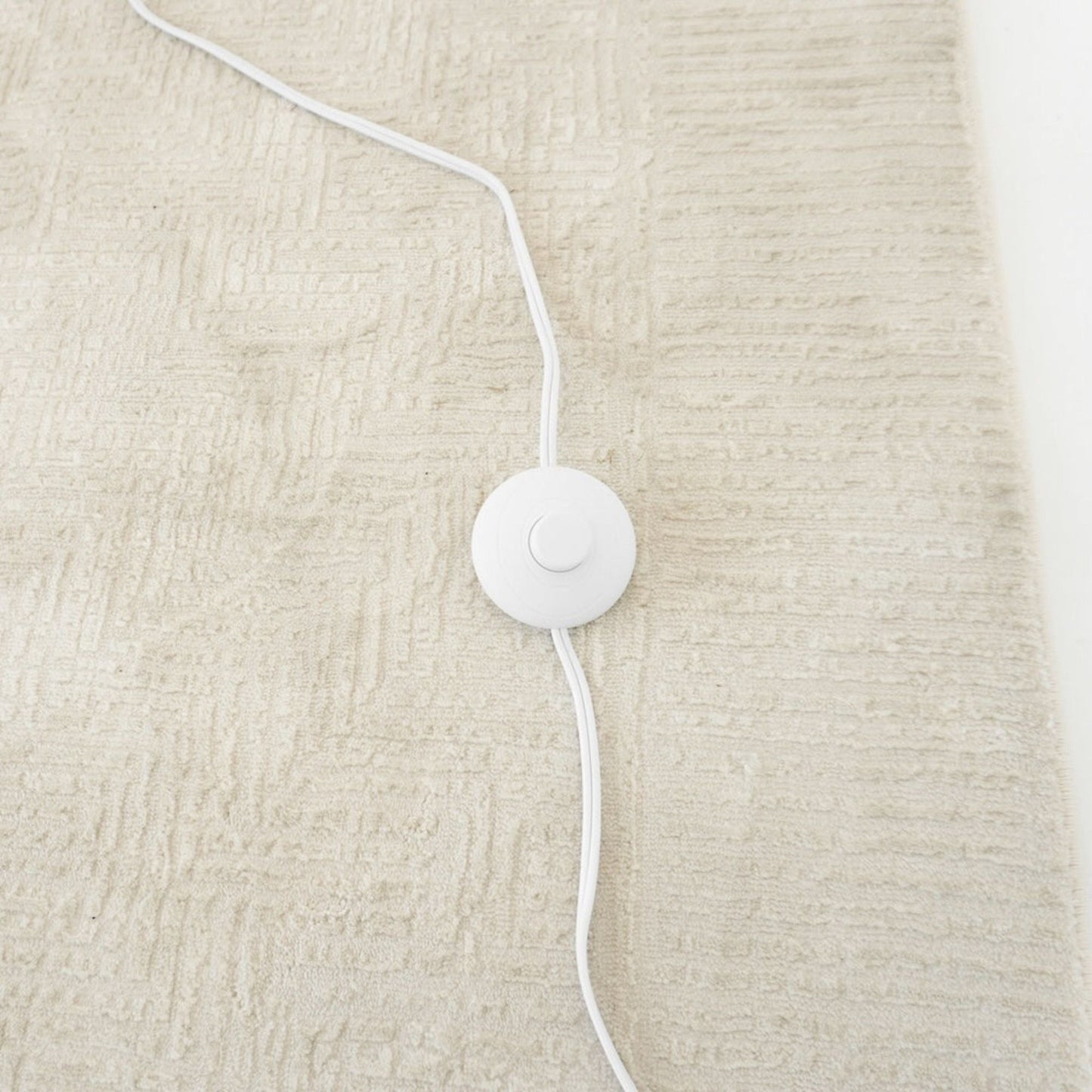 Brillo floor lamp base with white power cord and circular switch on beige carpet on Tampa Home & Garden Store