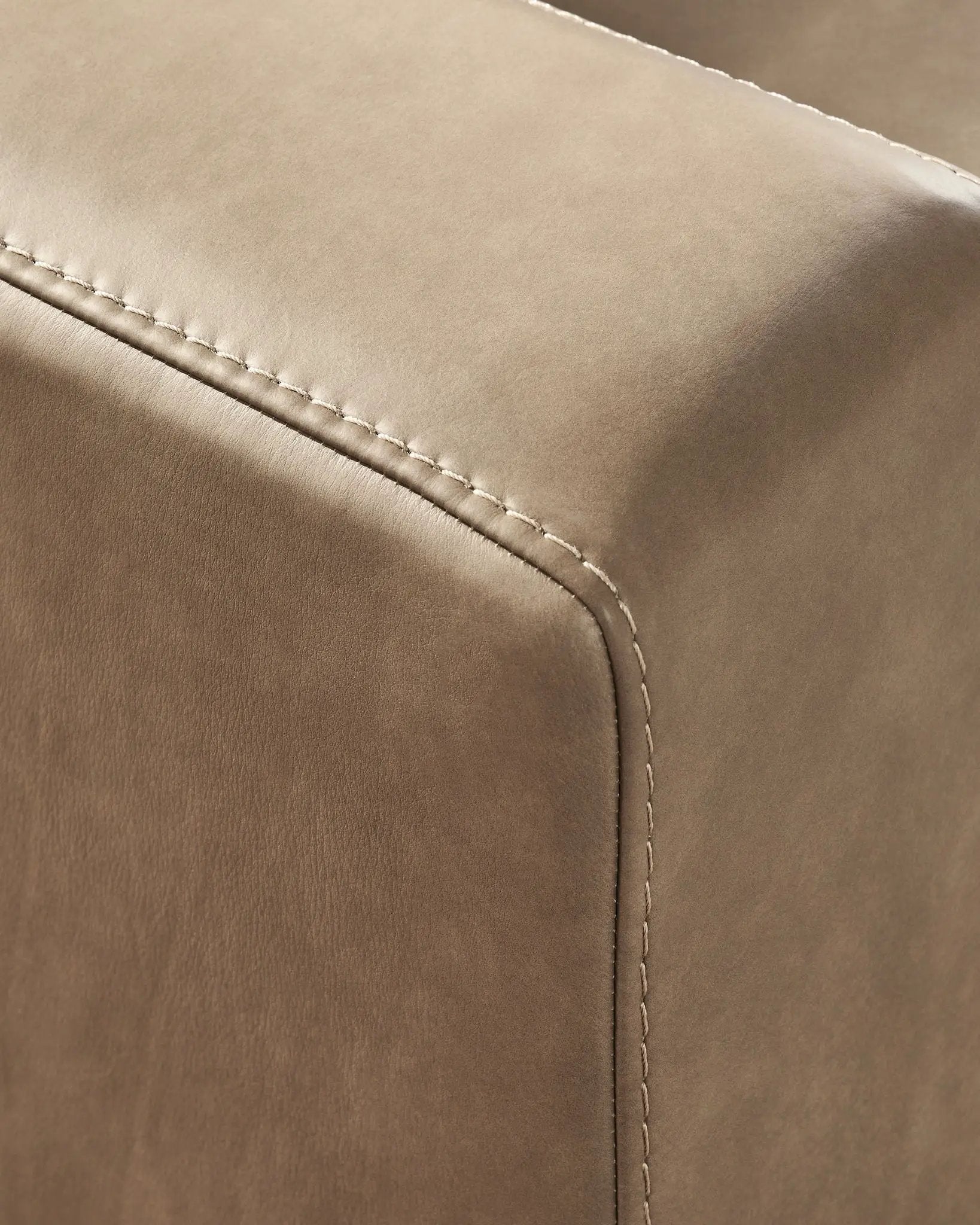 Veronella sectional by Unique Piece Furniture in tan leather with white contrast stitching on Tampa Home & Garden Store