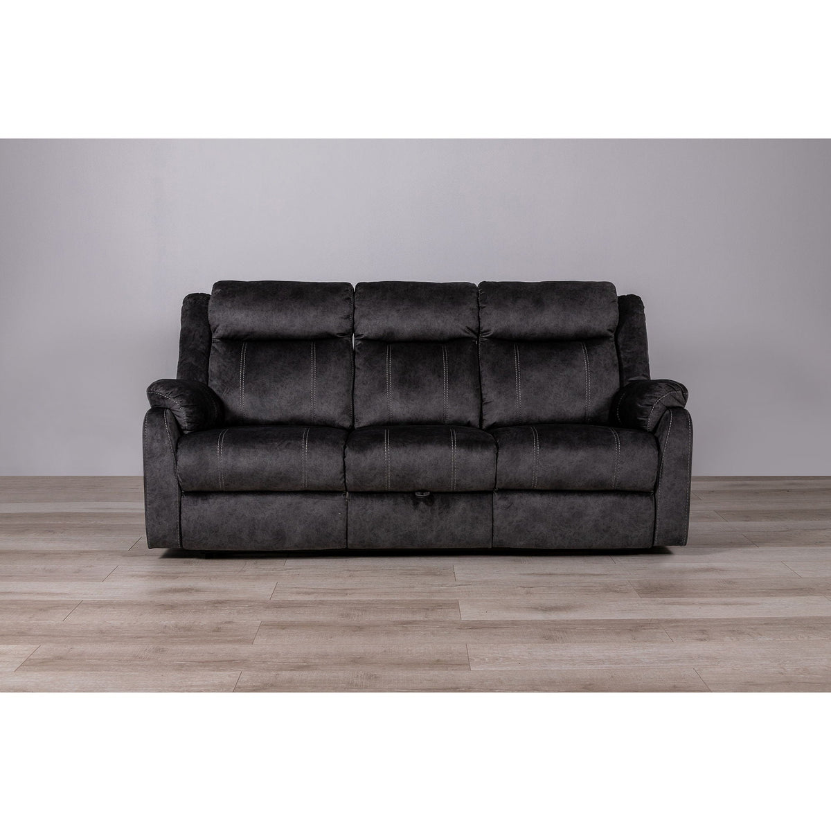 Sonet Domino reclining sofa by HouseOfZazla, dark charcoal fabric with white stitching on Tampa Home & Garden Store