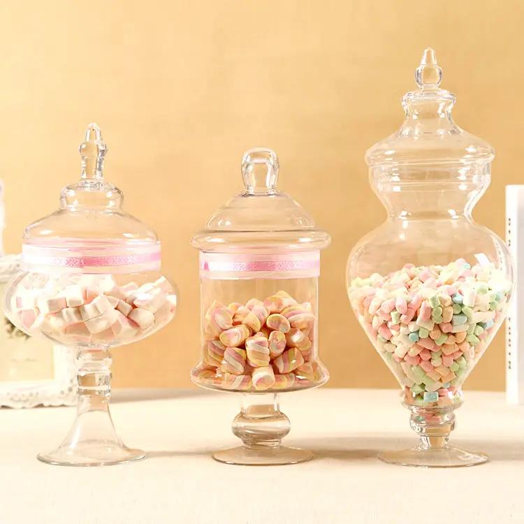 Three clear glass candy jars with lids, pastel marshmallows, FLIPSTYLEZLLC on Tampa Home & Garden Store