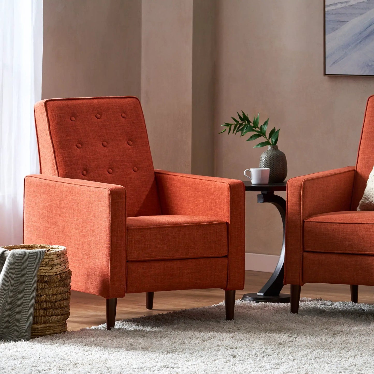 Pair of midcentury recliners in orange waffle-stitch fabric with tufted backs on Tampa Home & Garden Store