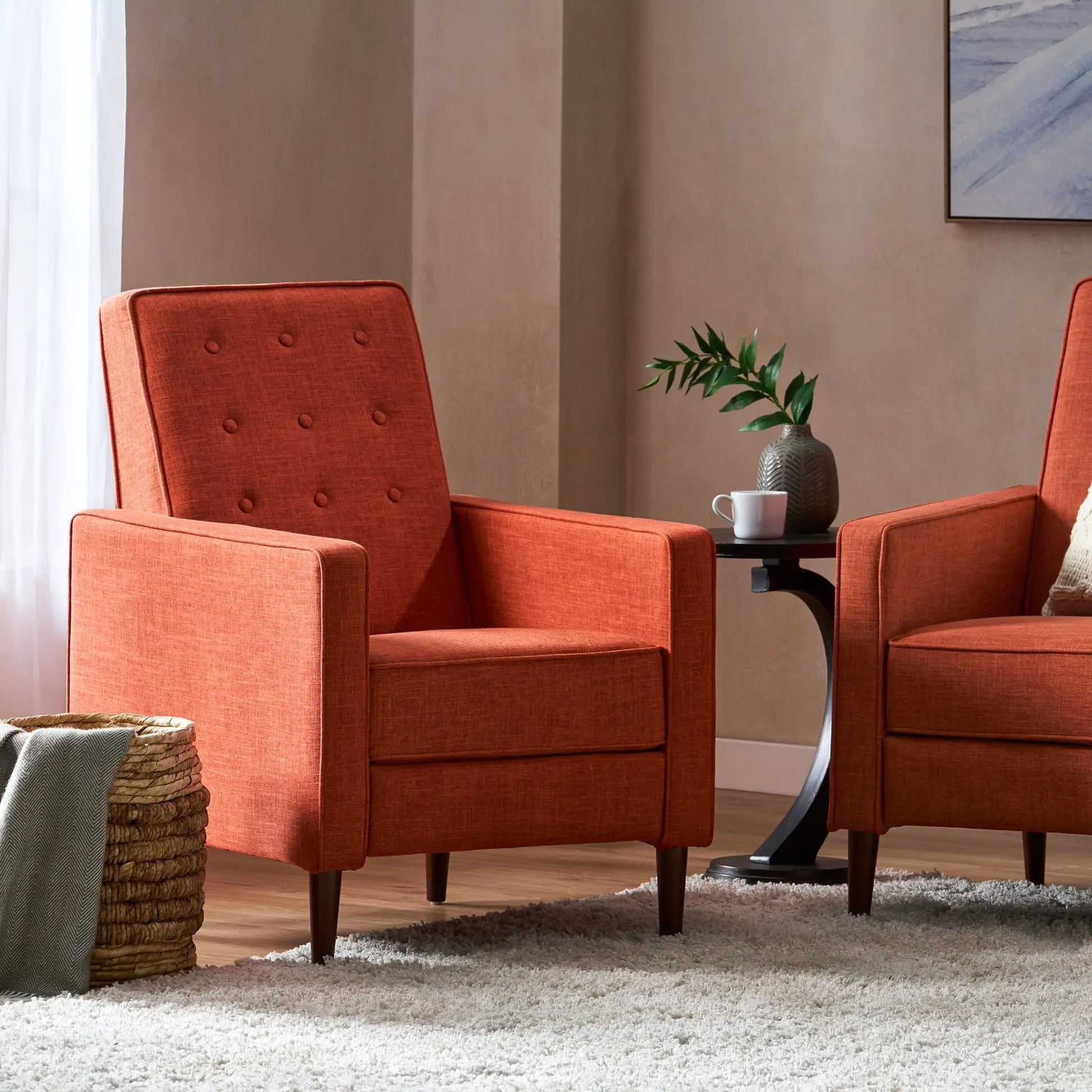 Pair of midcentury recliners in orange waffle-stitch fabric with tufted backs on Tampa Home & Garden Store