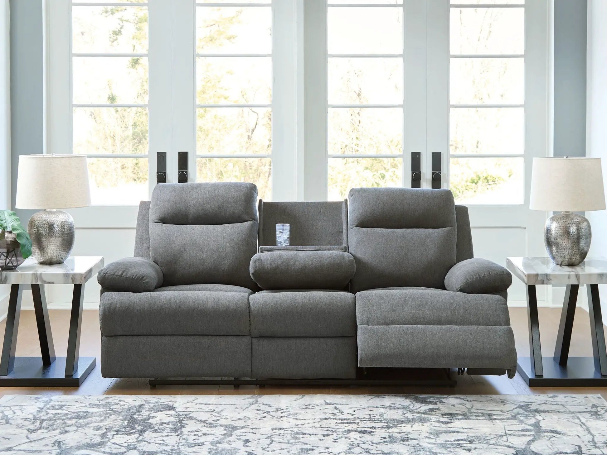 Side-Swipe reclining sofa with drop-down table in gray fabric upholstery on Tampa Home & Garden Store