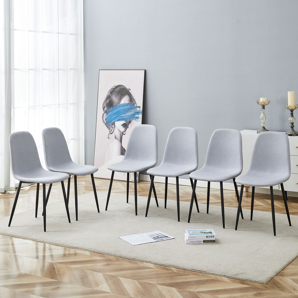 Modern medieval style cushioned side chairs set of 8 with black metal legs light gray upholstery on Tampa Home & Garden Store
