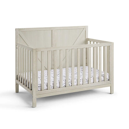 Barnside 4-in-1 Convertible Crib by Unique Piece Furniture in washed wood with slatted sides on Tampa Home & Garden Store