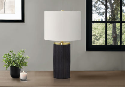 Table lamp HouseOfZazla with black concrete-style base, white shade, brass accents on Tampa Home & Garden Store