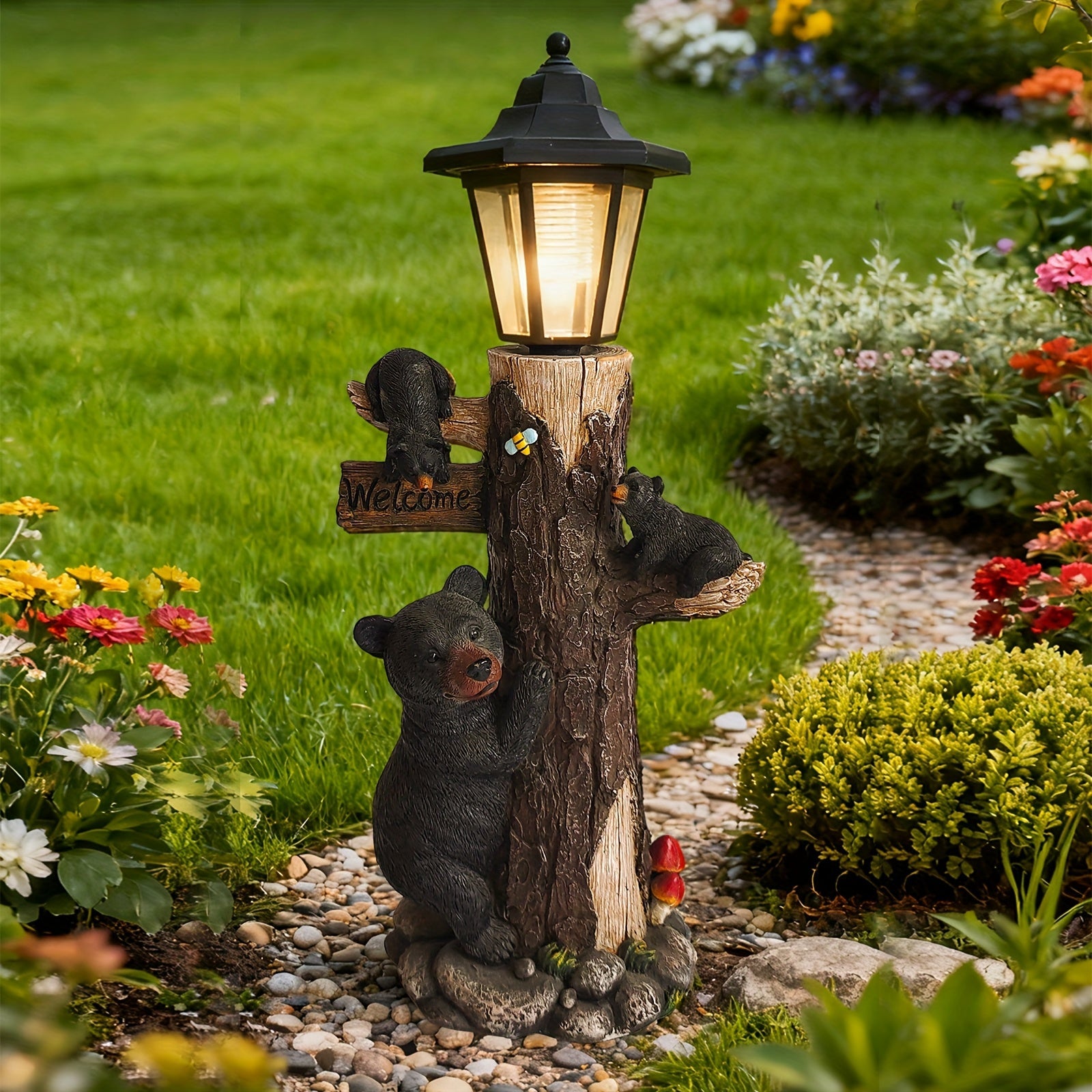 Black bear statue with a welcome sign garden sculpture on a tree-trunk base and solar light on Tampa Home & Garden Store