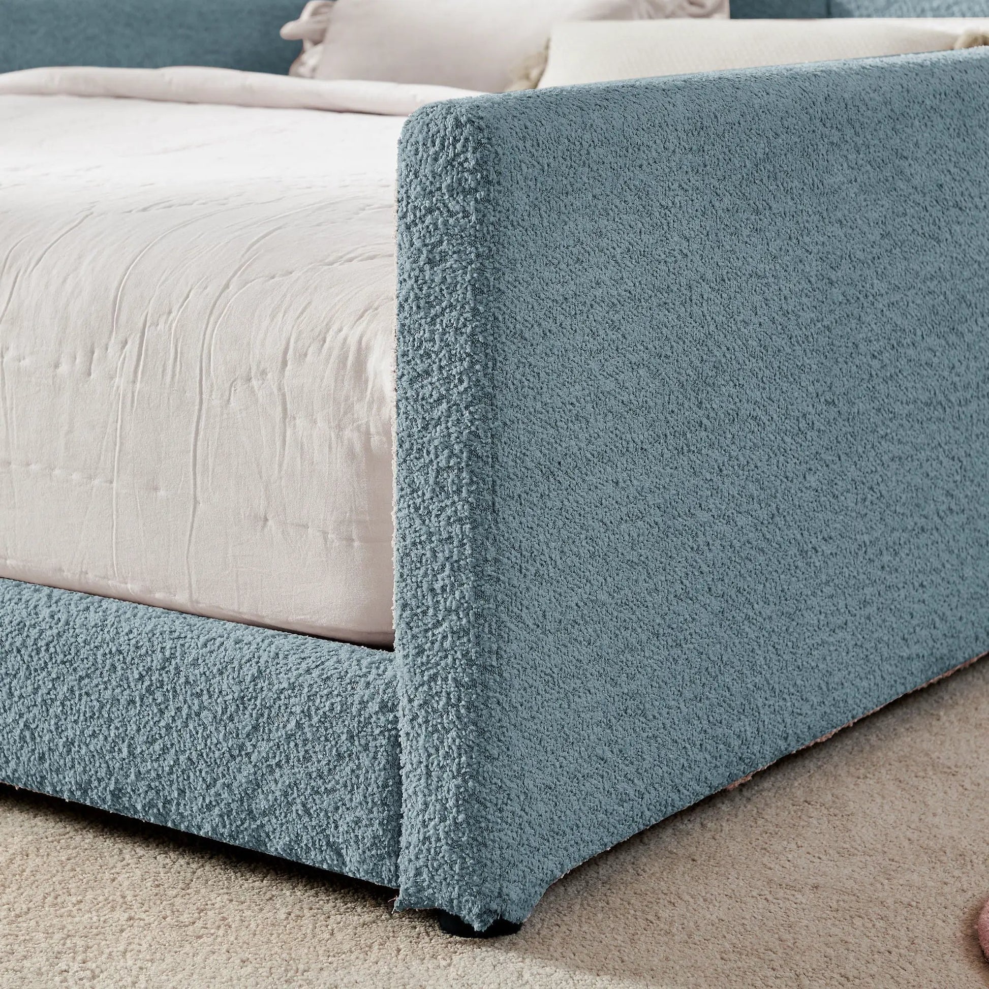 Blue rabbit-ear upholstered platform bed frame with safety rail and white mattress on Tampa Home & Garden Store