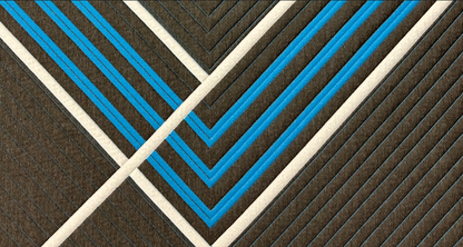 Tempagel Restonic plush mattress fabric closeup with brown base and blue geometric stripes on Tampa Home & Garden Store