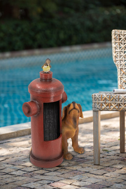 Red fire hydrant water fountain with a bird on the cap and a dog at the base by HouseOfZazla on Tampa Home & Garden Store