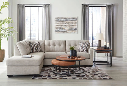 Mahoney Sectional beige fabric sofa by Unique Piece Furniture in living space with two round tables on Tampa Home & Garden Store