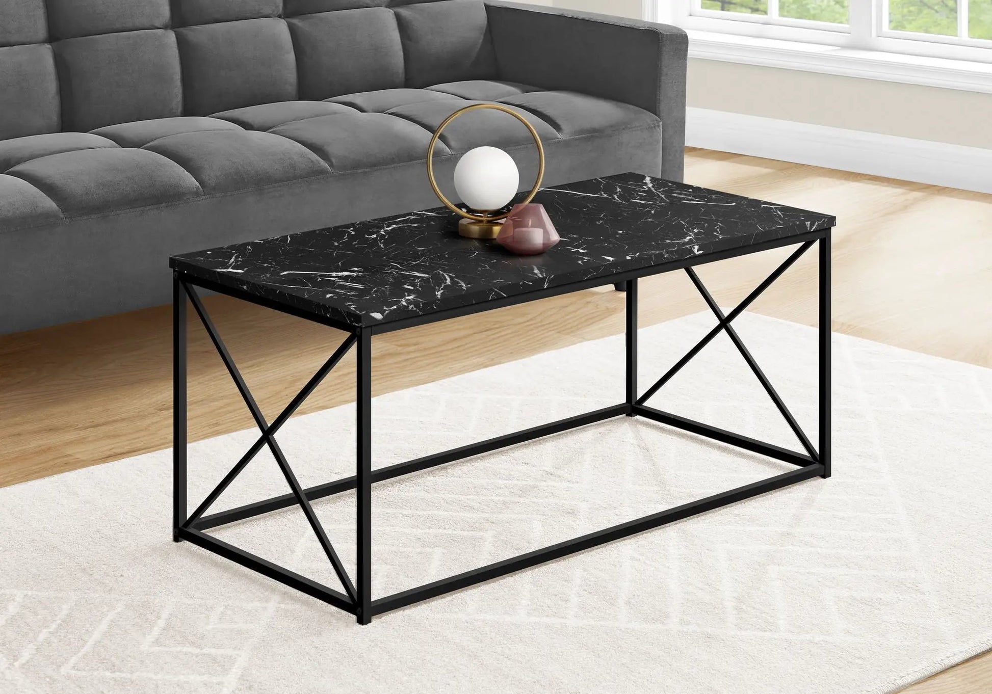 Rectangular coffee table with black marble top and metal X-frame base by Unique Piece Furniture on Tampa Home & Garden Store