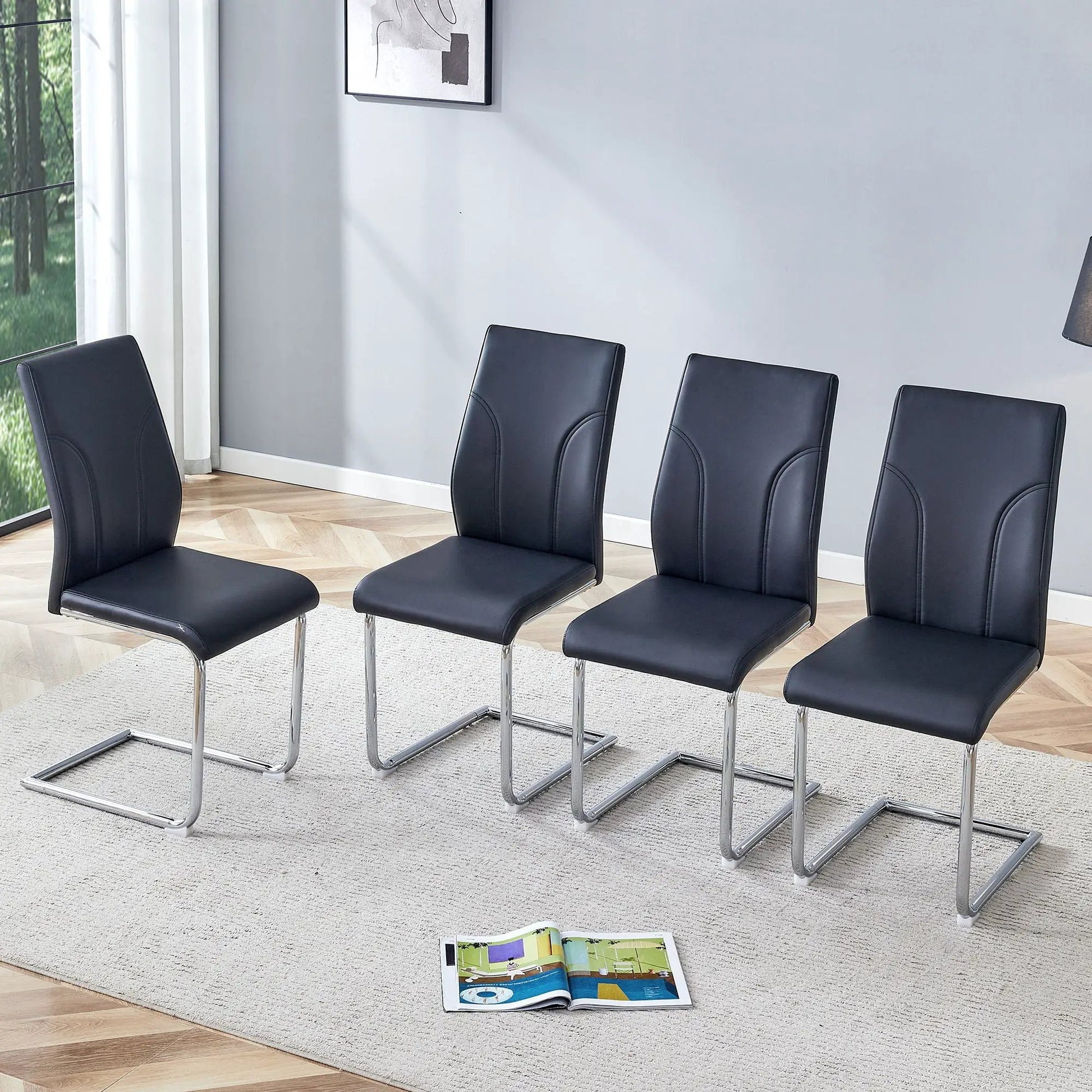 Dining chairs in black leatherette with backs and chrome legs by Unique Piece Furniture on Tampa Home & Garden Store