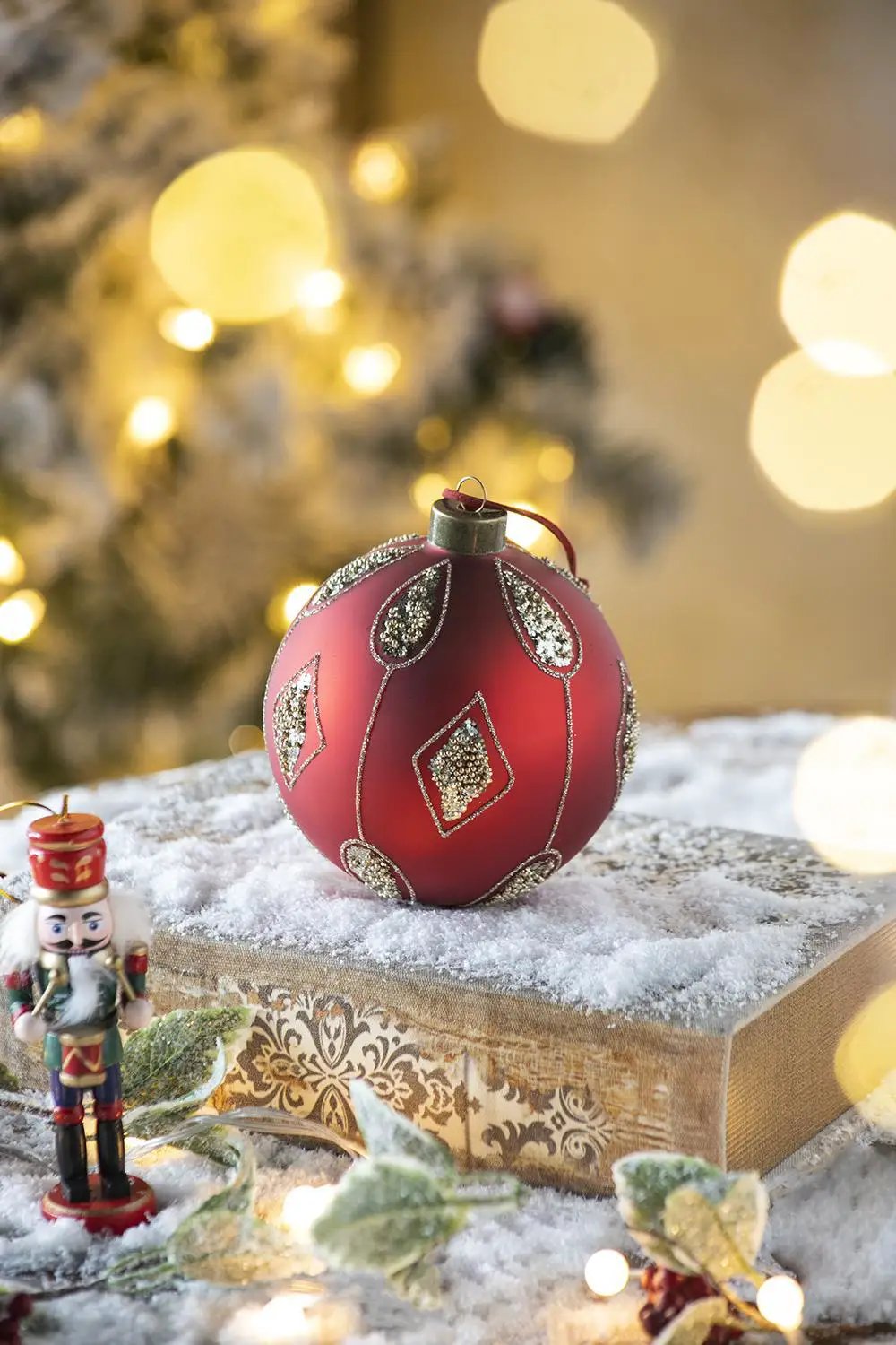 Christmas ball ornament red with silver glitter teardrop diamonds pattern on snowy gift box on Tampa Home & Garden Store