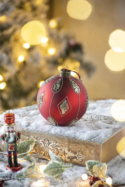 Christmas ball ornament red with silver glitter teardrop diamonds pattern on snowy gift box on Tampa Home & Garden Store