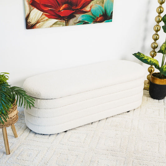 Cabana bench with storage ivory upholstery in a bright living room with plants and a gold lamp on Tampa Home & Garden Store