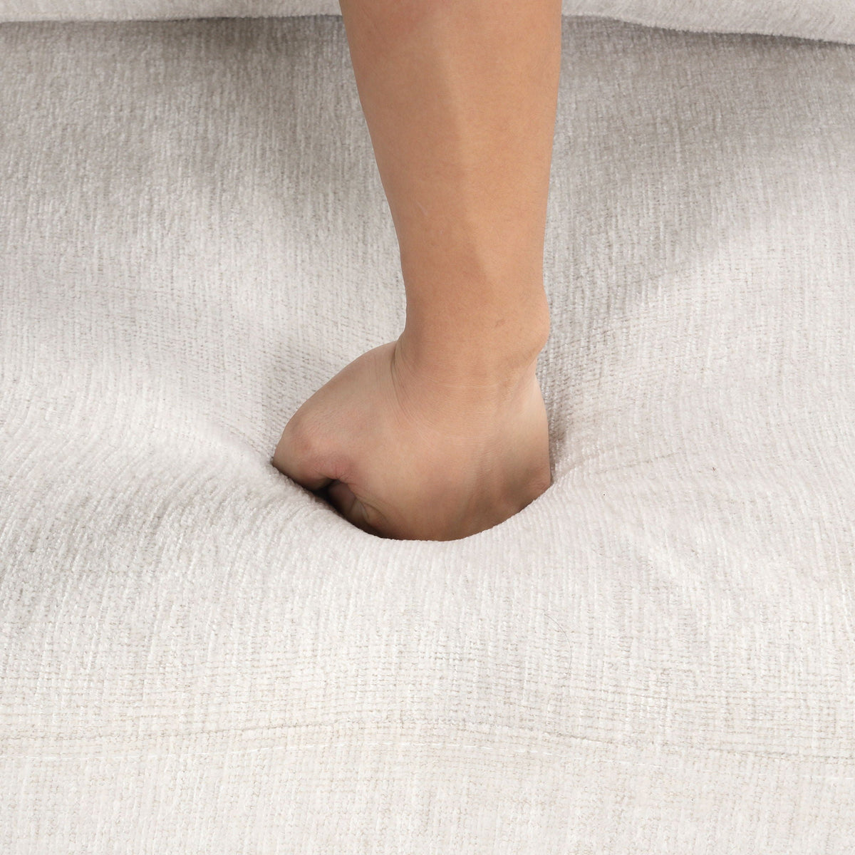 U-Shaped Sectional Sofa Pull Out Sofa Bed on light gray carpet with a bare foot on Tampa Home & Garden Store