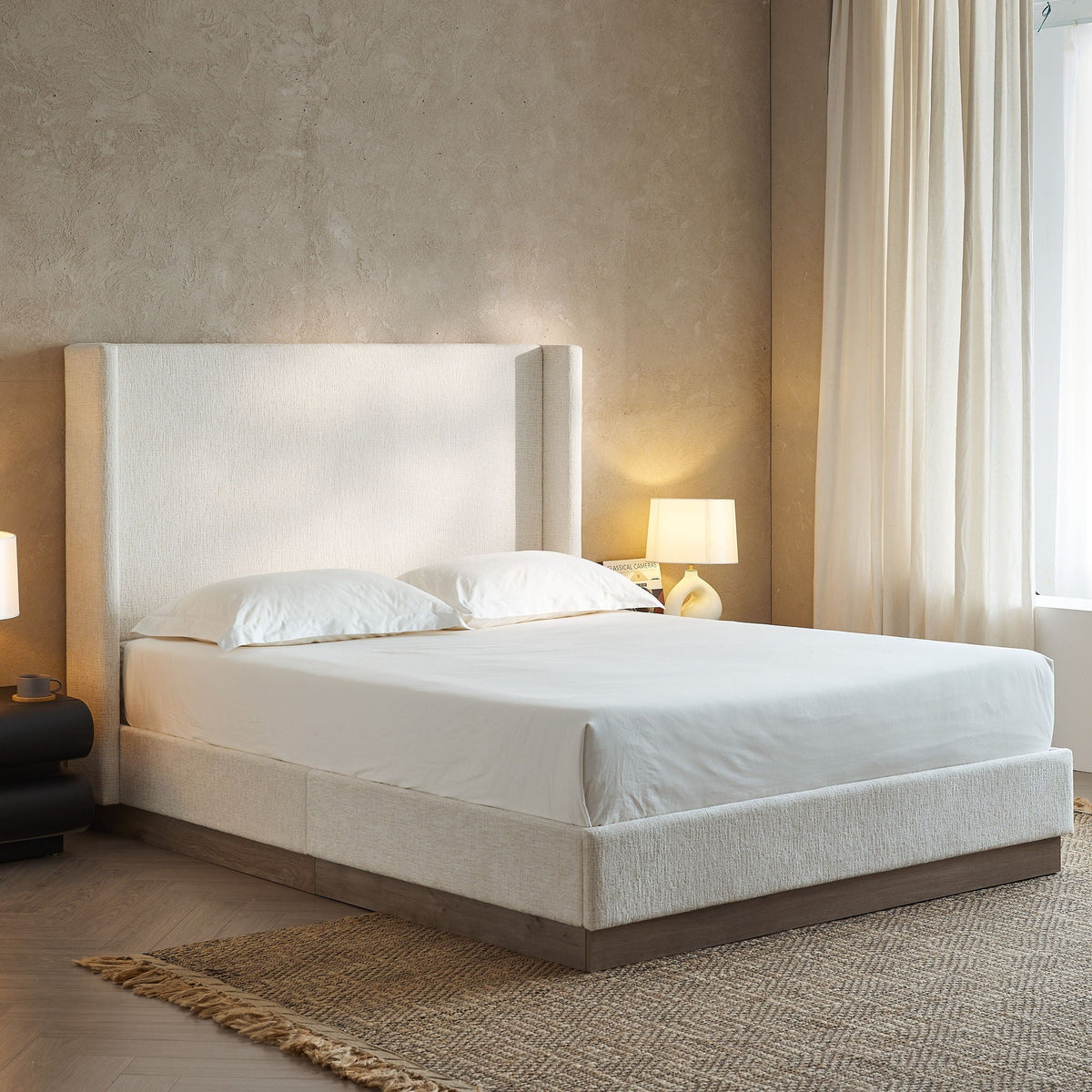 Hosford upholstered wingback bed with beige fabric and wood base platform in a serene bedroom on Tampa Home & Garden Store