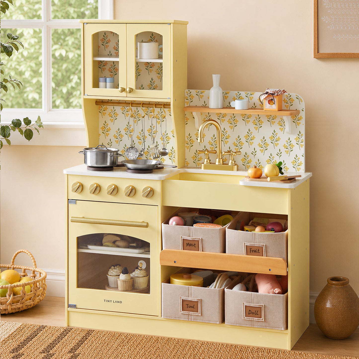 Tiny Land wooden play kitchen in yellow with glass-front cabinet and floral backsplash and sink on Tampa Home & Garden Store