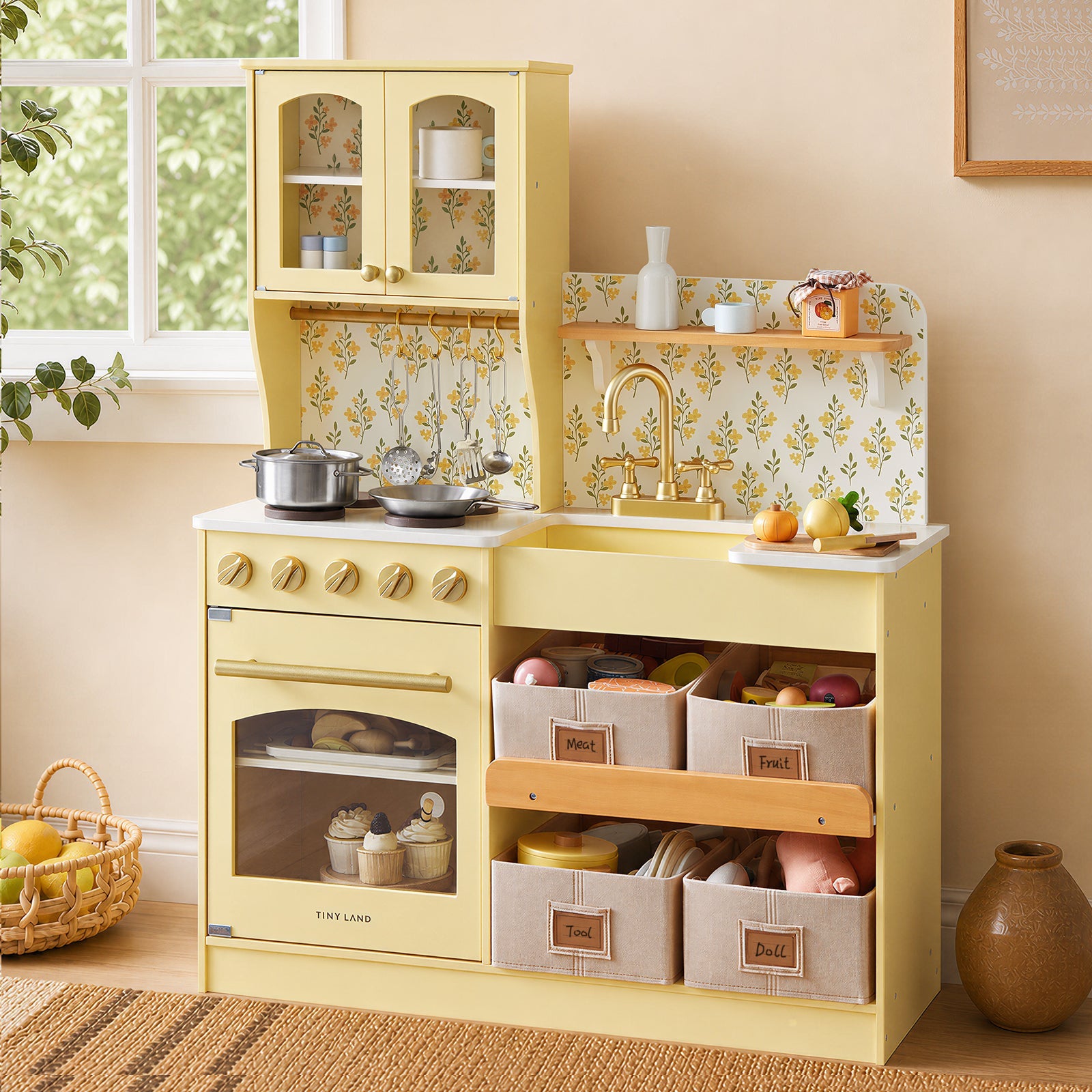Tiny Land wooden play kitchen in yellow with glass-front cabinet and floral backsplash and sink on Tampa Home & Garden Store