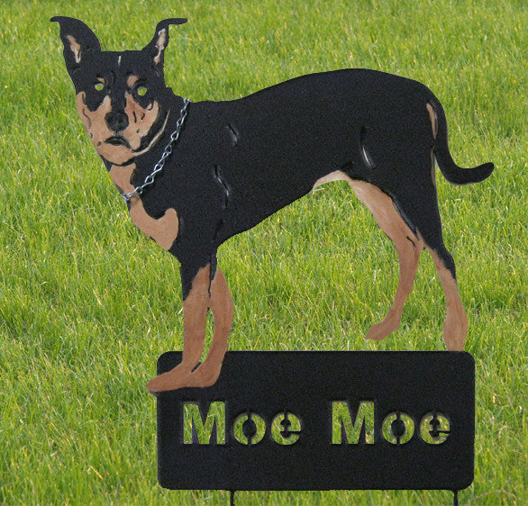 Pet portrait garden statue, black and tan dog with chain collar standing on a Moe Moe sign on Tampa Home & Garden Store