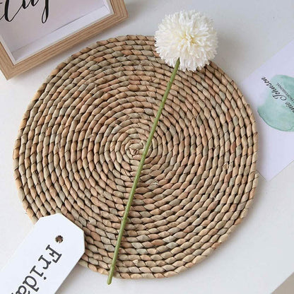 Artificial Chrysanthemum ball flower stem with white bloom on round woven placemat on Tampa Home & Garden Store