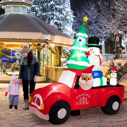 8ft inflatable Santa driving a red car with LED lights and air blower, snowman and tree decor on Tampa Home & Garden Store