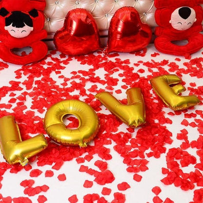 Stevvex 1000pcs fake rose petals scattered with gold Love balloons and red heart pillows on Tampa Home & Garden Store