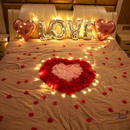 Stevvex 1000pcs fake deodorized rose petals for decorations, red/white heart on bed with warm LED lights and love balloons on Tampa Home & Garden Store