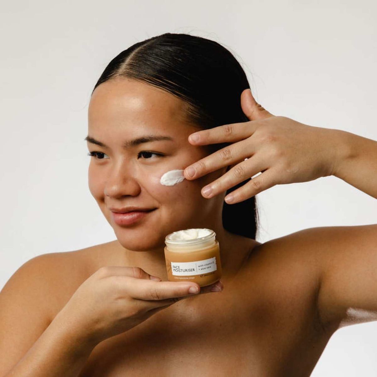 Hydration Skincare Set UpCircle face moisturiser in amber jar with white cream on cheek on Tampa Home & Garden Store