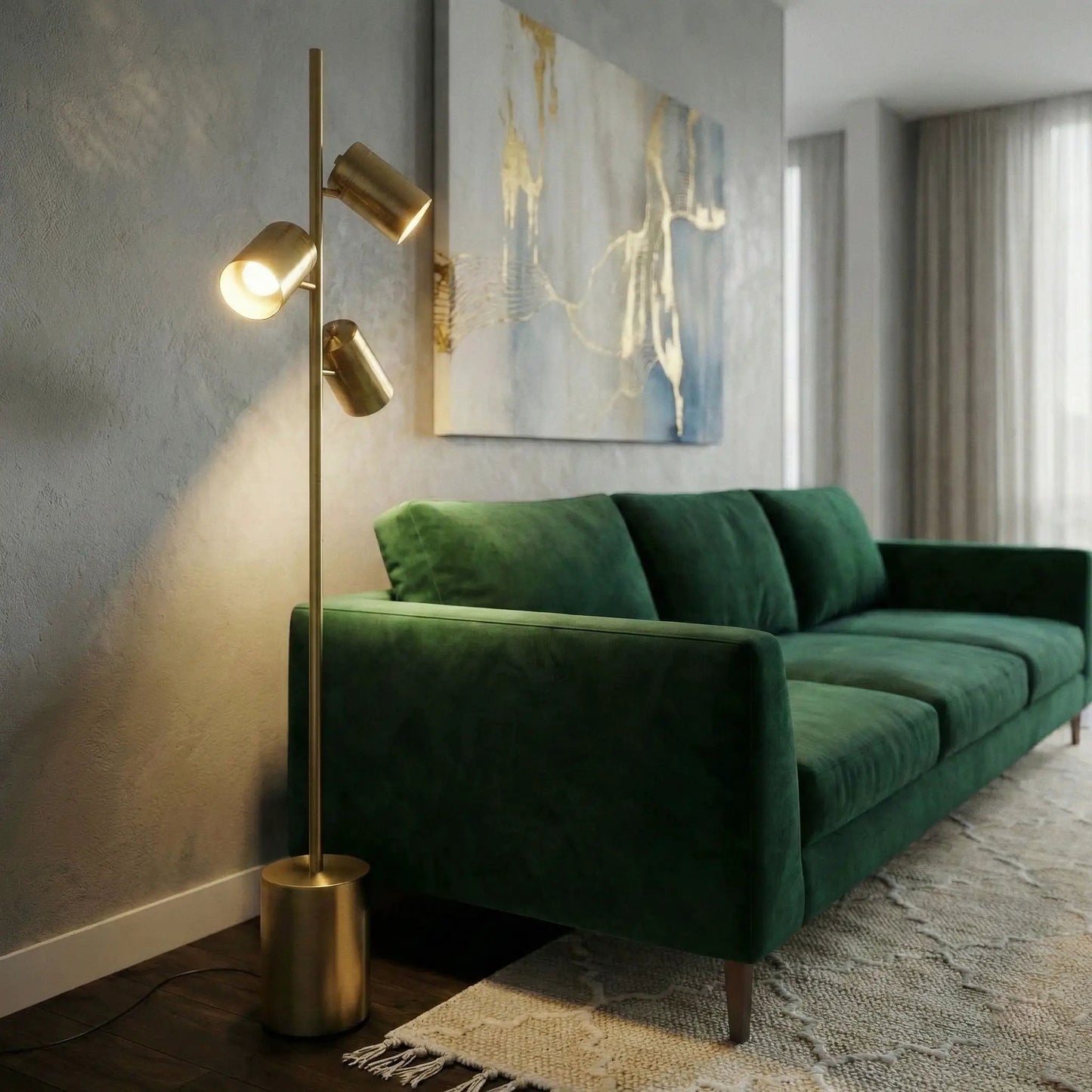 Harmony gold floor lamp with triple spotlights on a block base beside a gray wall and green sofa on Tampa Home & Garden Store