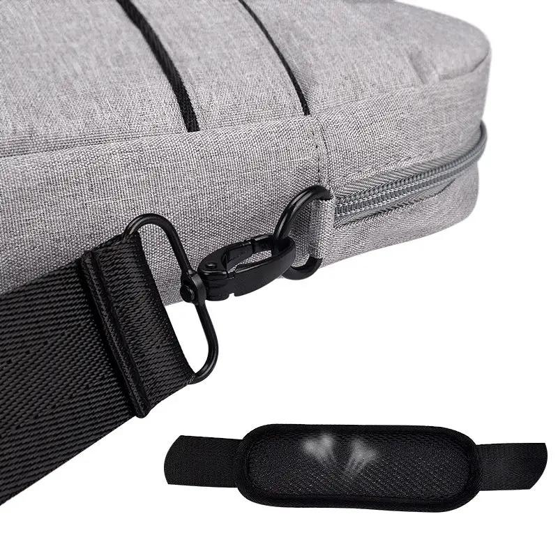 Grey fabric laptop bag with black adjustable shoulder strap and zipper detail on Tampa Home & Garden Store