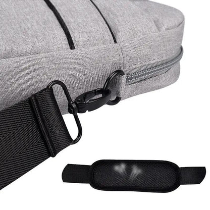 Grey fabric laptop bag with black adjustable shoulder strap and zipper detail on Tampa Home & Garden Store