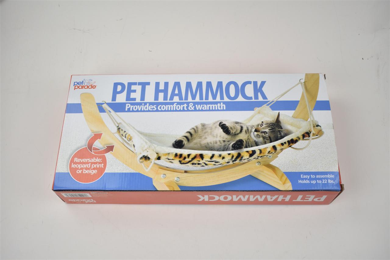 Solid wood hammock bed by Sell My Stuff with leopard print reversible cover on wooden frame on Tampa Home & Garden Store