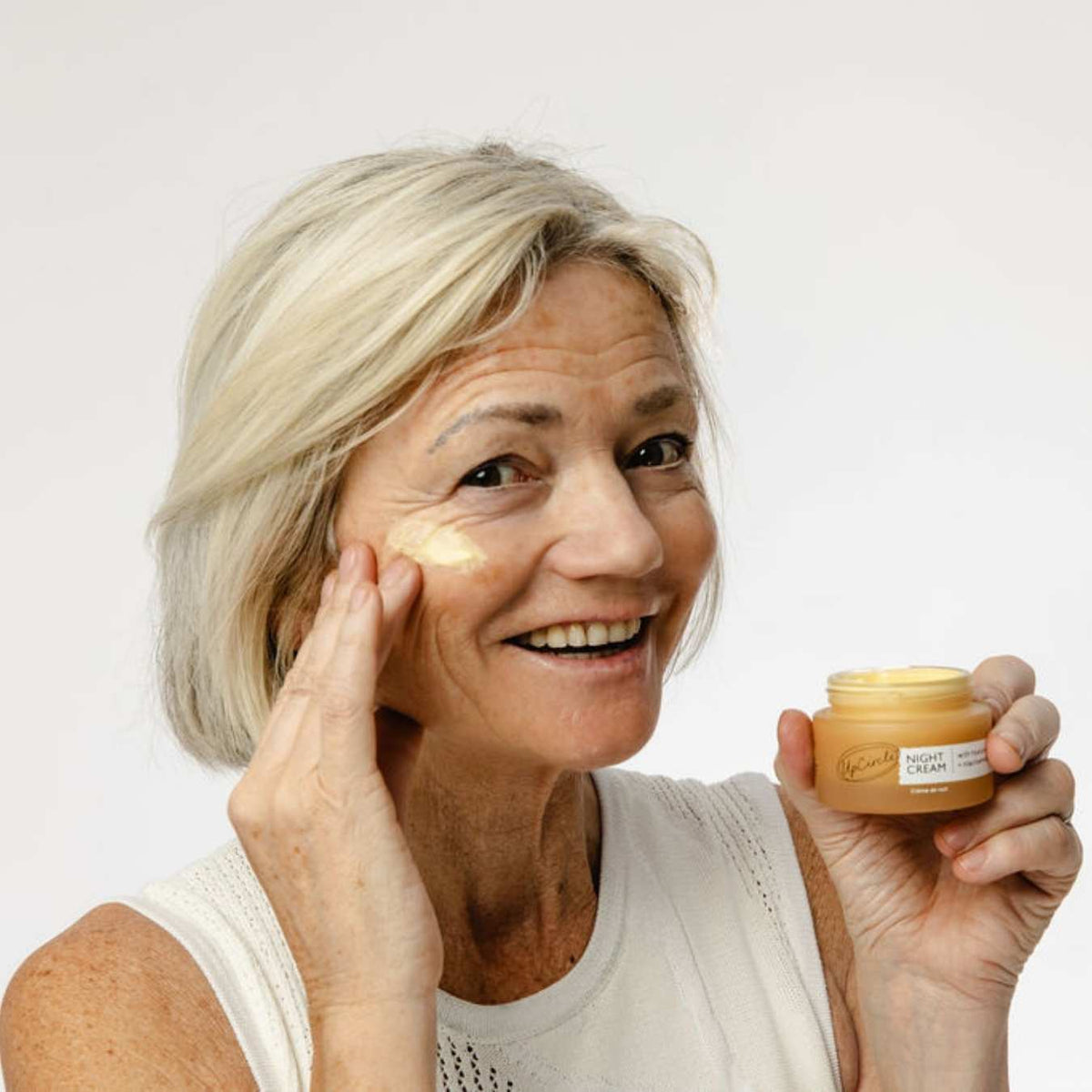 UpCircle Night Cream with Hyaluronic Acid + Niacinamide in amber jar, applied to skin on Tampa Home & Garden Store